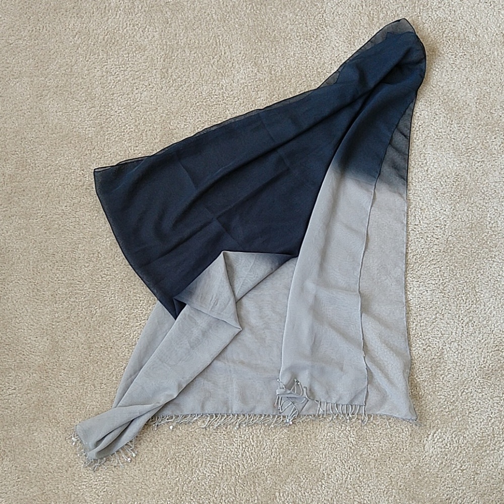 Silk-like transparent evening wrap with fringe